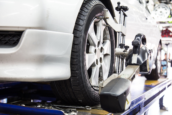 wheel alignment device attached to car tire